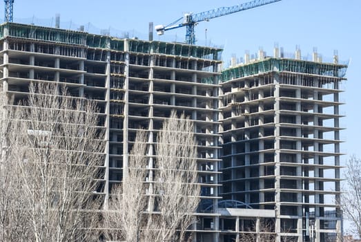 Large building under construction in sunny day