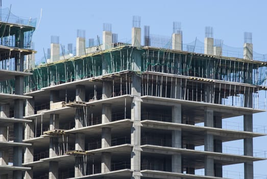 Large building under construction in sunny day