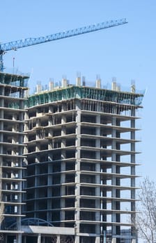 Large building under construction in sunny day