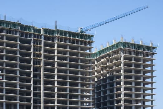 Large building under construction in sunny day