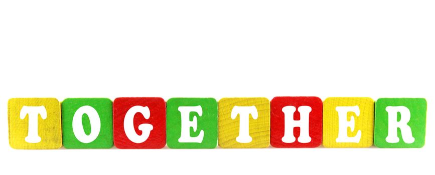 together - isolated text in wooden building blocks