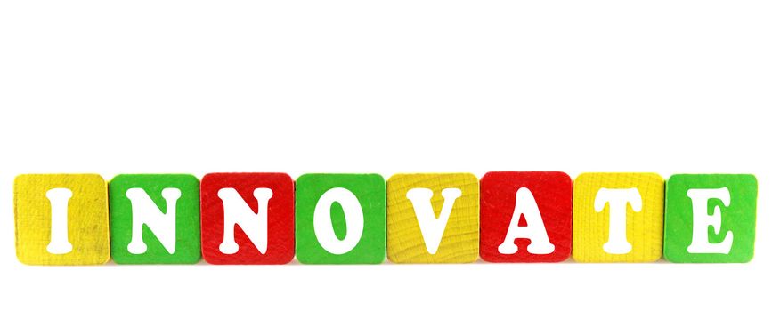 innovate - isolated text in wooden building blocks