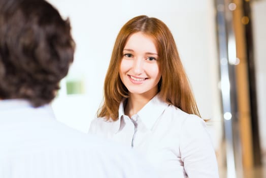 Attractive woman talking with a man, close up portrait