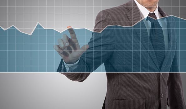 business man touching graph on screen, grey background