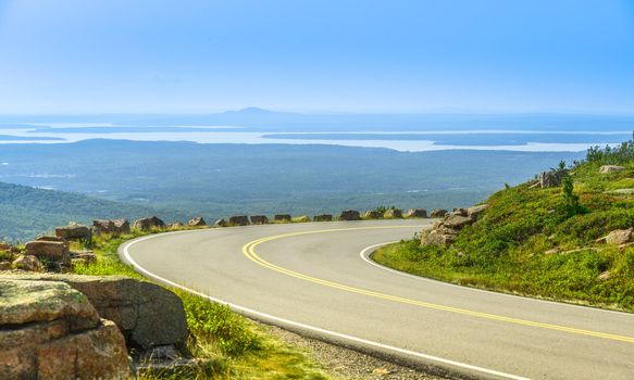 Cadillac Mountain drive in Acadia National Park, Maine in a clear summer day. A ponoramic view of distant lakes and hills.