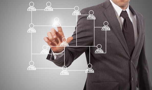 business man touching social network structure, grey background