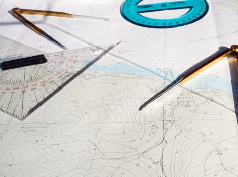 compass, goniometer and other tool. Route on a Maritime Chart