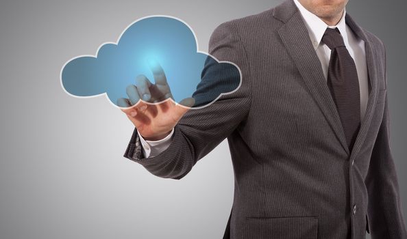 business man touching cloud on screen, grey background