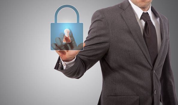 Businessman is pressing the security icon, grey background