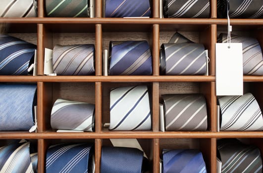 A lot of ties in the wooden box