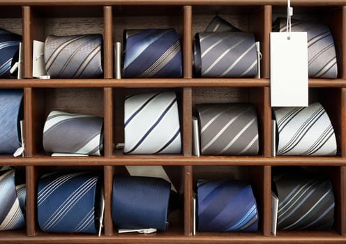 A lot of ties in the wooden box