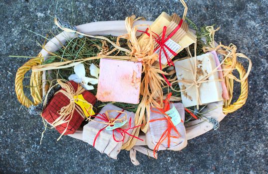 A lot of Homemade soaps inside a wicker basket