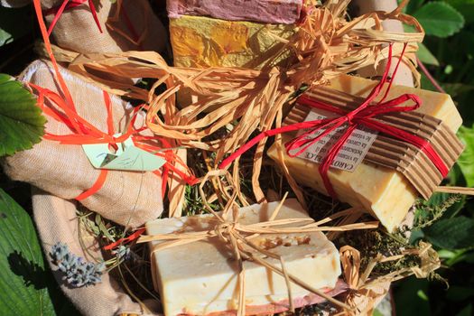 A lot of Homemade soaps inside a wicker basket