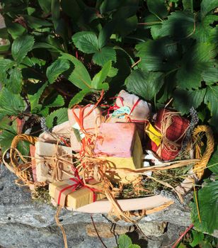 A lot of Homemade soaps inside a wicker basket