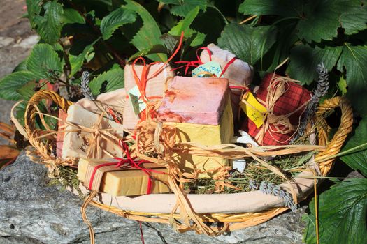 A lot of Homemade soaps inside a wicker basket