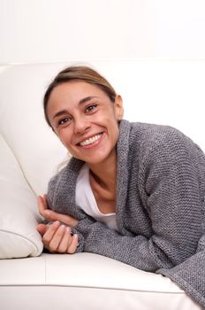 woman smiling on sofa