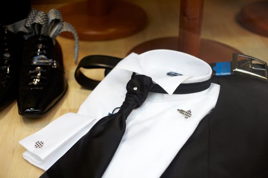 Black Shoes and black necktie on a white elegant shirt