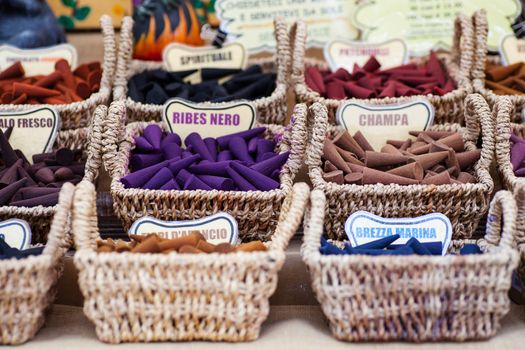 A lot of various scented Incense inside the wicker baskets
