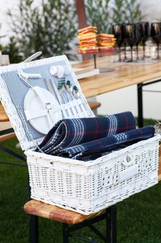 White Wicker basket with crockery and cutlery