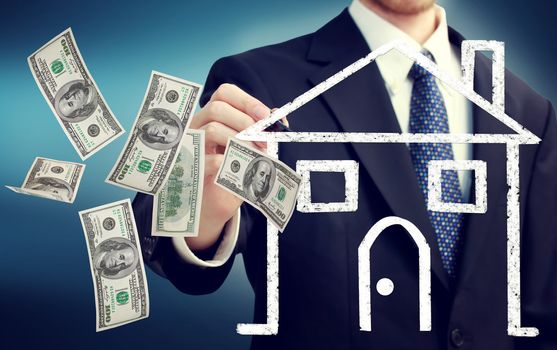 Business man drawing a house illustration and flying hundred dollar bills