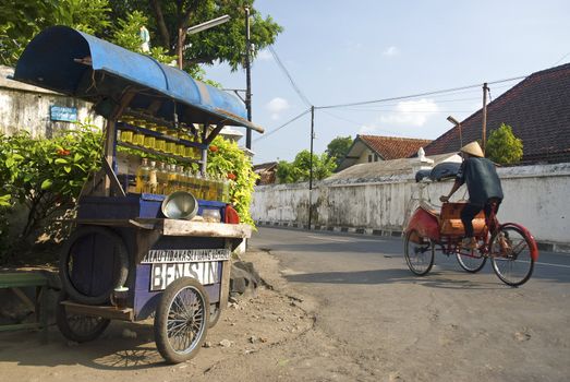 petrol stall and cyclo becak taxi in solo city indonesia