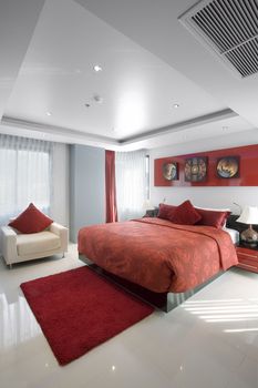 Panoramic view of nice stylish modern bedroom. Images on the wall were changed.