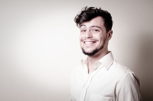 stylish modern guy with white shirt on gray background