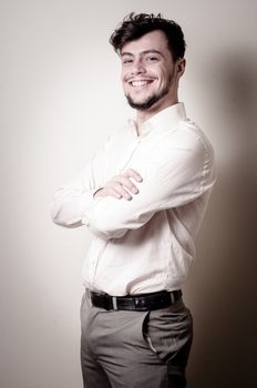 stylish modern guy with white shirt on gray background