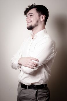 stylish modern guy with white shirt on gray background