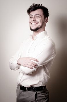 stylish modern guy with white shirt on gray background