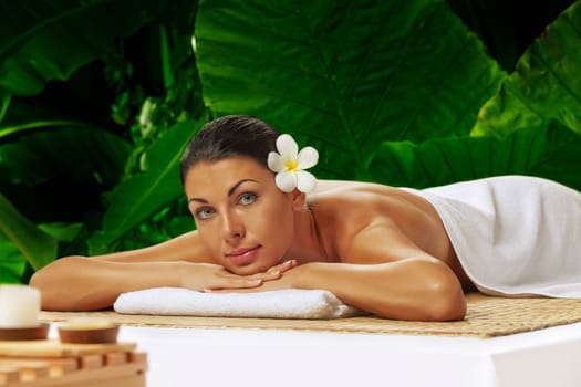 portrait of young beautiful woman in spa environment.