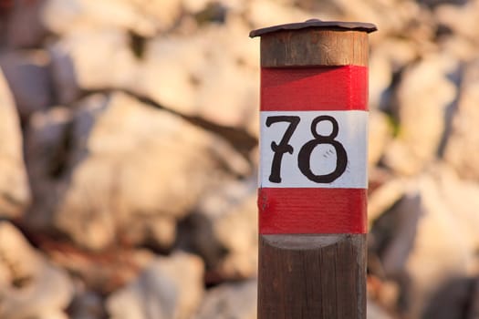 Number seventy eight in a wooden pole
