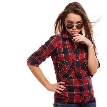 Young attractive woman in squared shirt and sunglasses