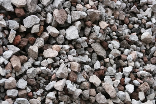 A pile of rocks in a variety of shapes and colors at a construction site in Cotacachi, Ecuador