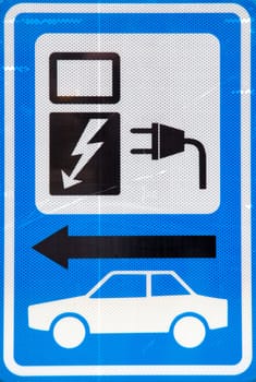 blue and white sign for loading electric car