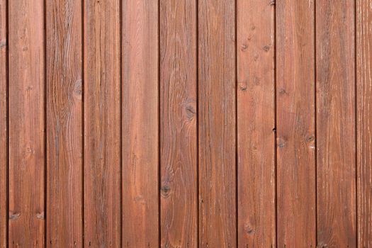 part of fencing or boardingwith brown varnish