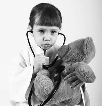 girl with teddy bear,doctor examination