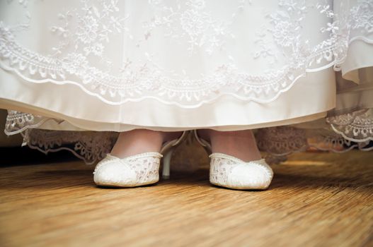 wedding dress and shoe. look from a floor level