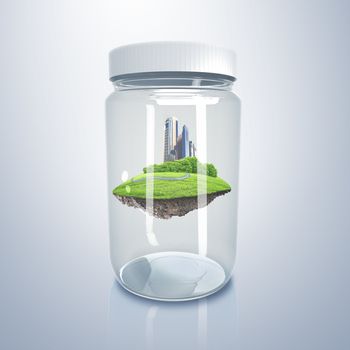 Green city on the hill inside a glass jar