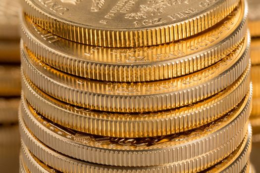 Stacks of gold eagle one troy ounce golden coins from US Treasury mint