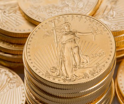 Stacks of gold eagle one troy ounce golden coins from US Treasury mint