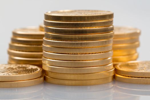 Stacks of gold eagle one troy ounce golden coins from US Treasury mint