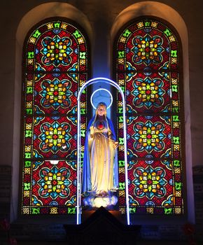 Virgin Mary Statue Shrine Stained Glass Notre Dame Cathedral, Nha Tho Duc Ba, built in 1883 largest cathedral in French Empire Saigon Ho Chi Minh City Vietnam