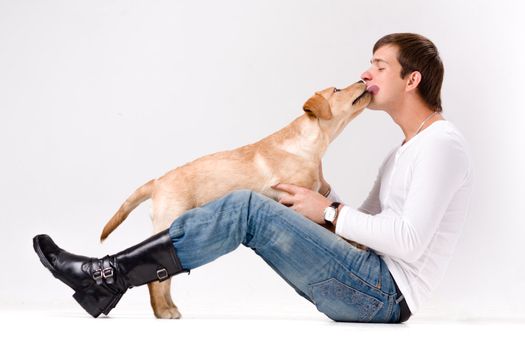 handsome man with dog over gray background
