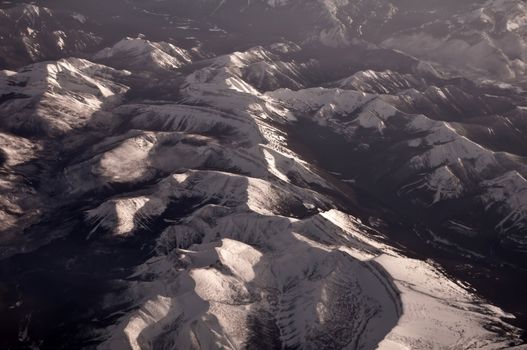 aerial of rocky mountains from airplane