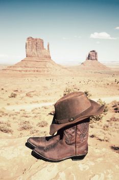 boots and hat at Monument Valley, vertical view, USA