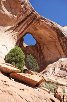 Bowtie Arch, a pothole arch formed when a pothole broke through from the top of the cliff