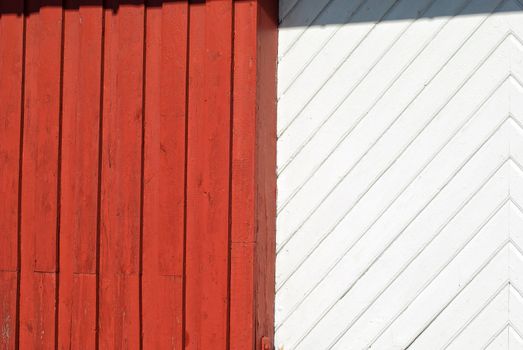 Old textured red and white painted wood pattern surface on a wall background