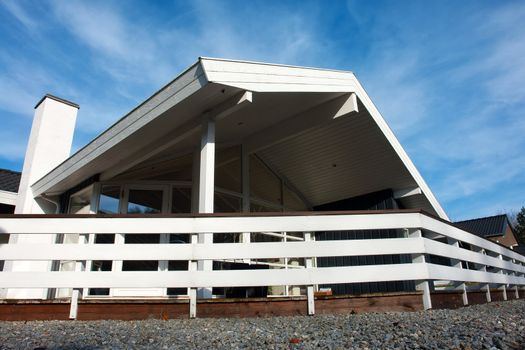  Modern style designed private wooden home summer house taken in low angle             