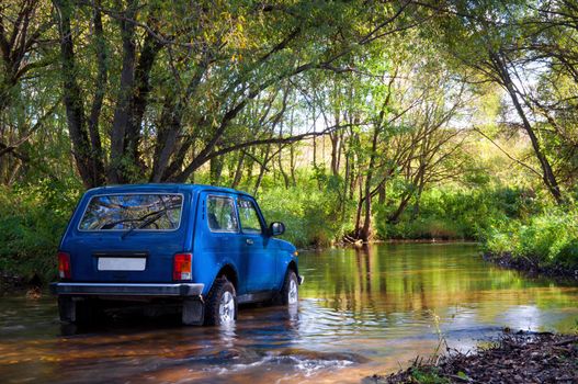 Soviet and Russian SUV Lada Niva 4x4 in water